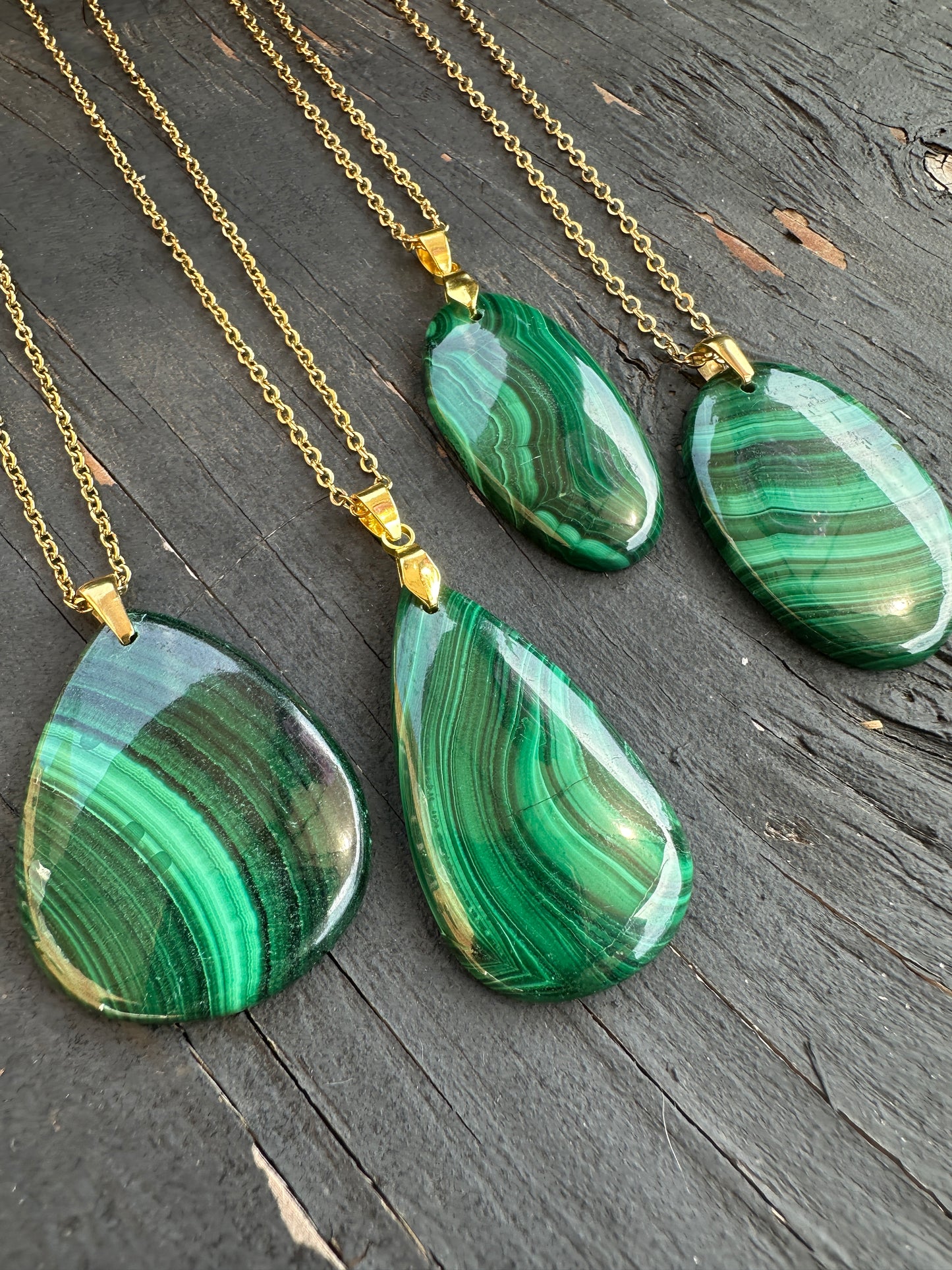 Four Malachite pendants on gold stainless steel chains