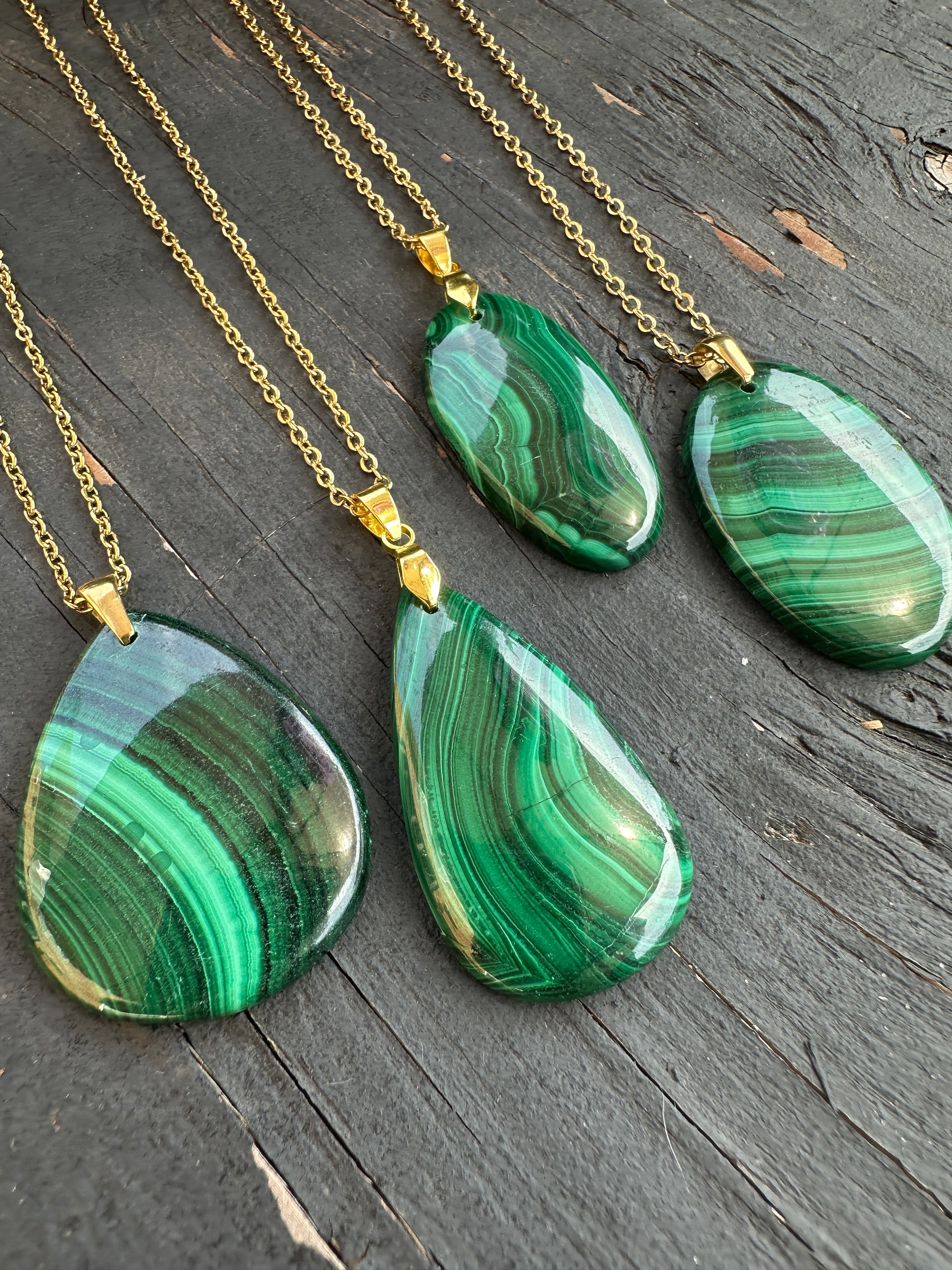 Four Malachite pendants on gold stainless steel chains